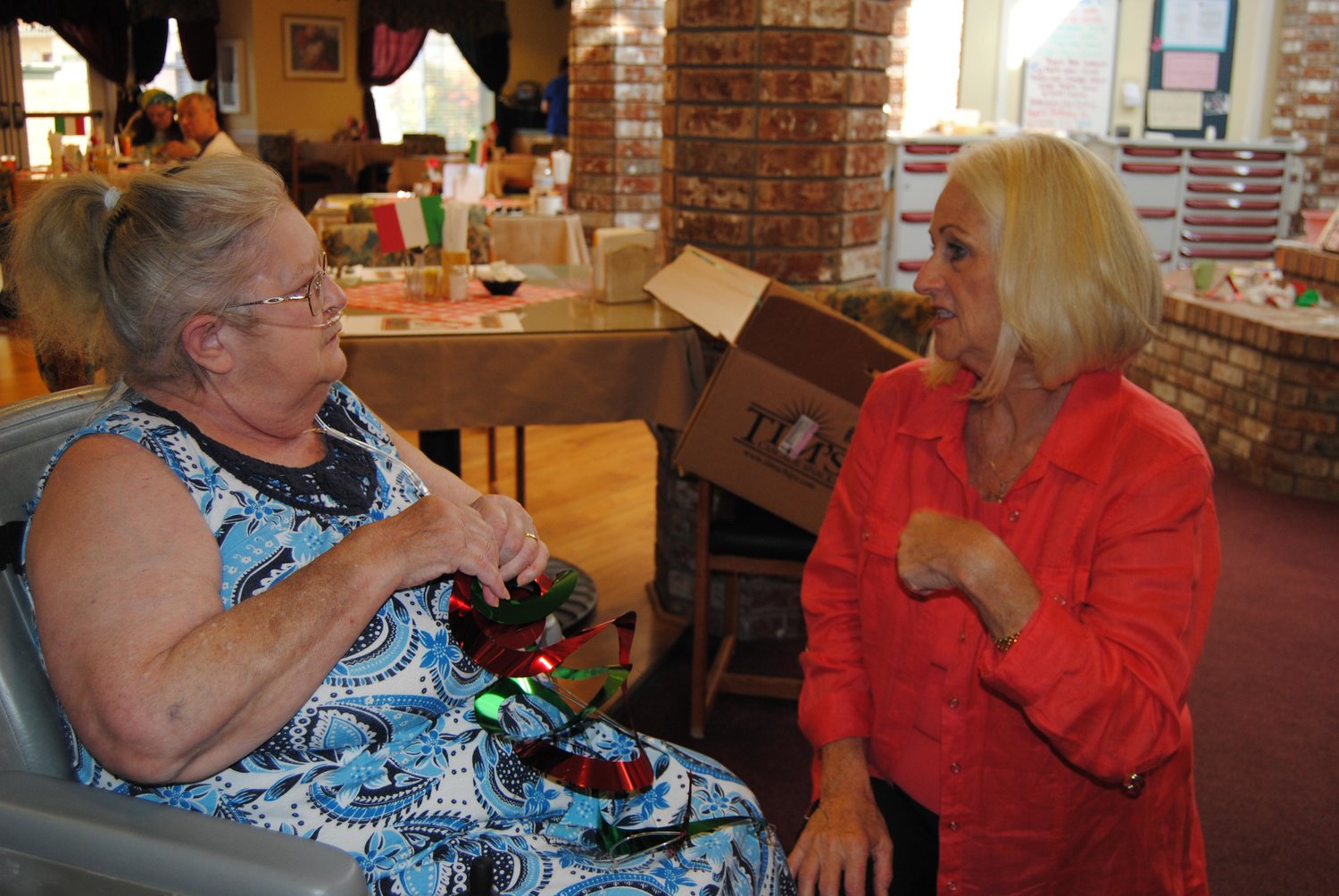 Jesycua Pinnell, left, talks with Senator Randi Becker about living at Easthaven Villa in this file photo.