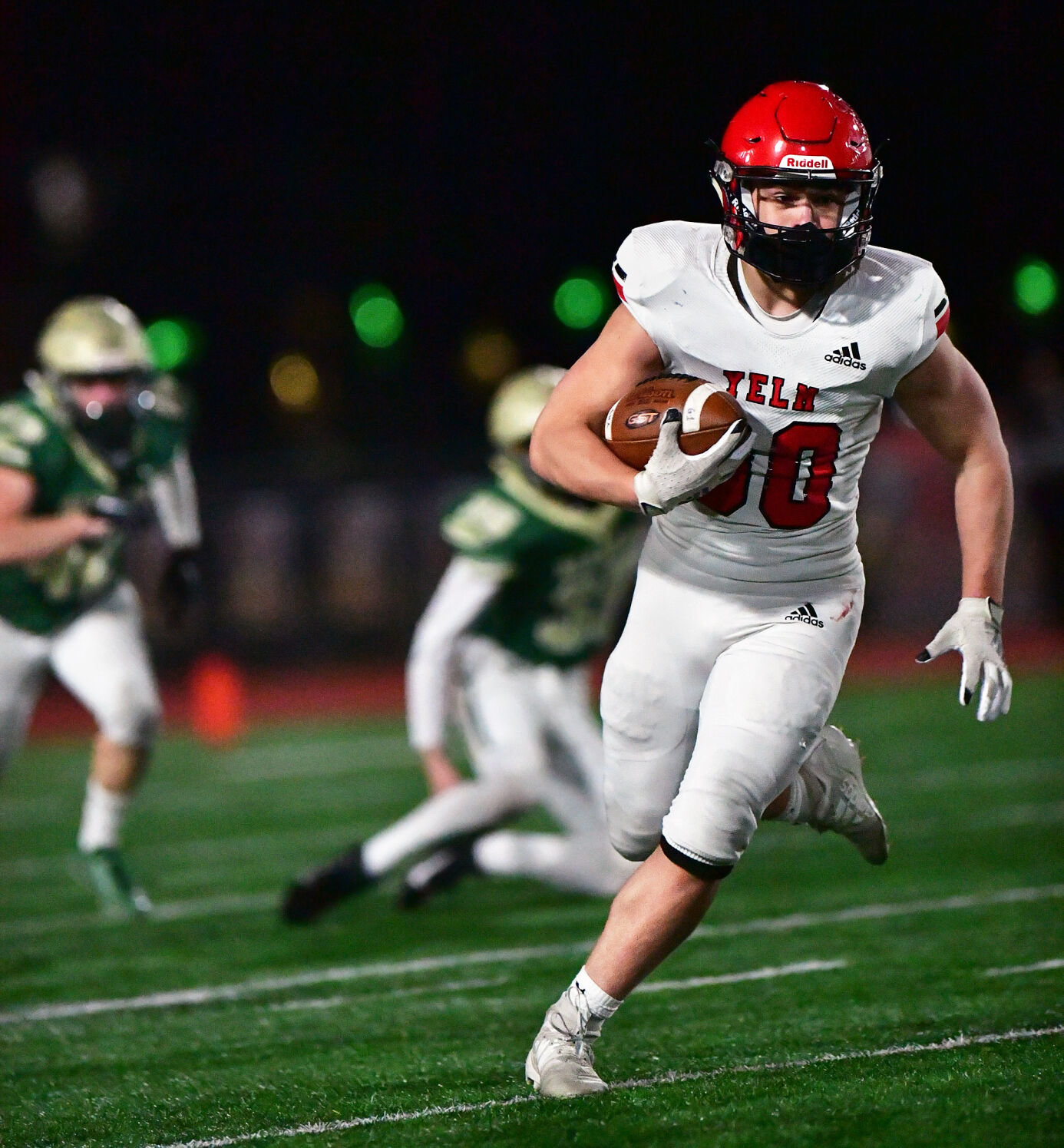 Yelm High School running back William Carreto gallops for a big gain on Friday, March 12, against Timberline High School at South Sound Stadium.