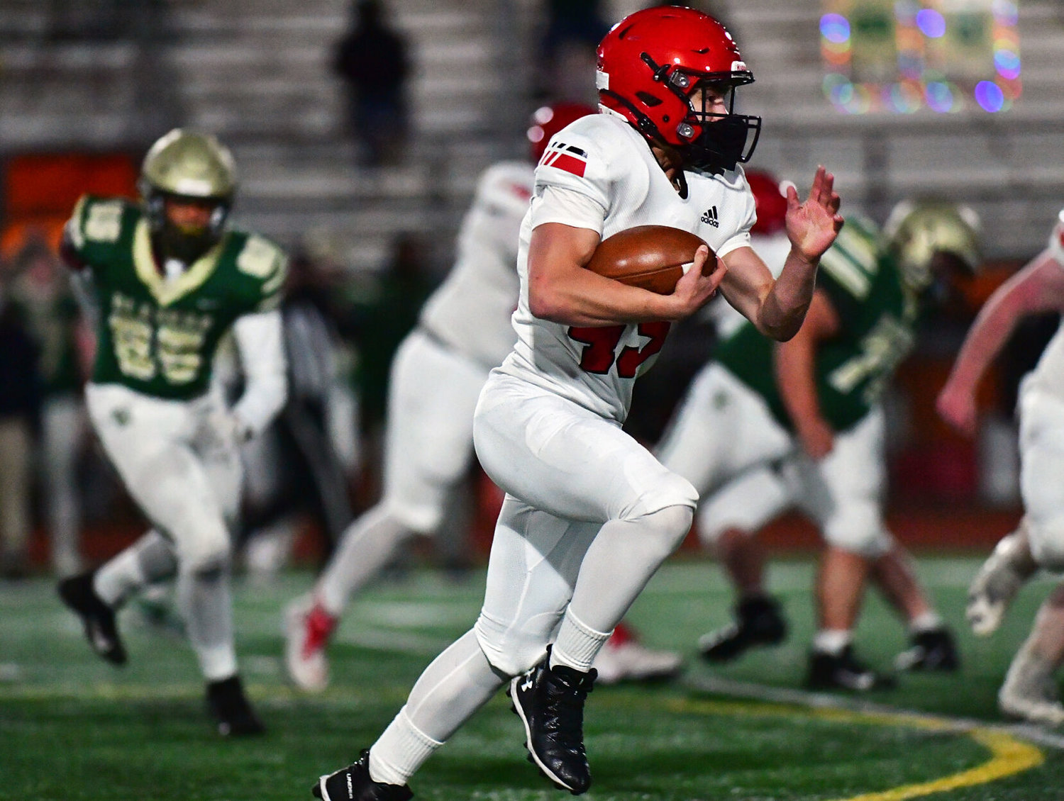 Yelm High School running back Dylan Conklin rambles for long yardage on Friday, March 12, against Timberline High School at South Sound Stadium.