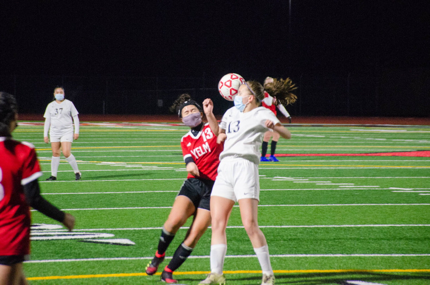 Yelm sophomore Alyssa Forde-Nihipali and River Ridge junior Karissa Leland fight for the ball in a conference matchup Tuesday night between the two teams. 