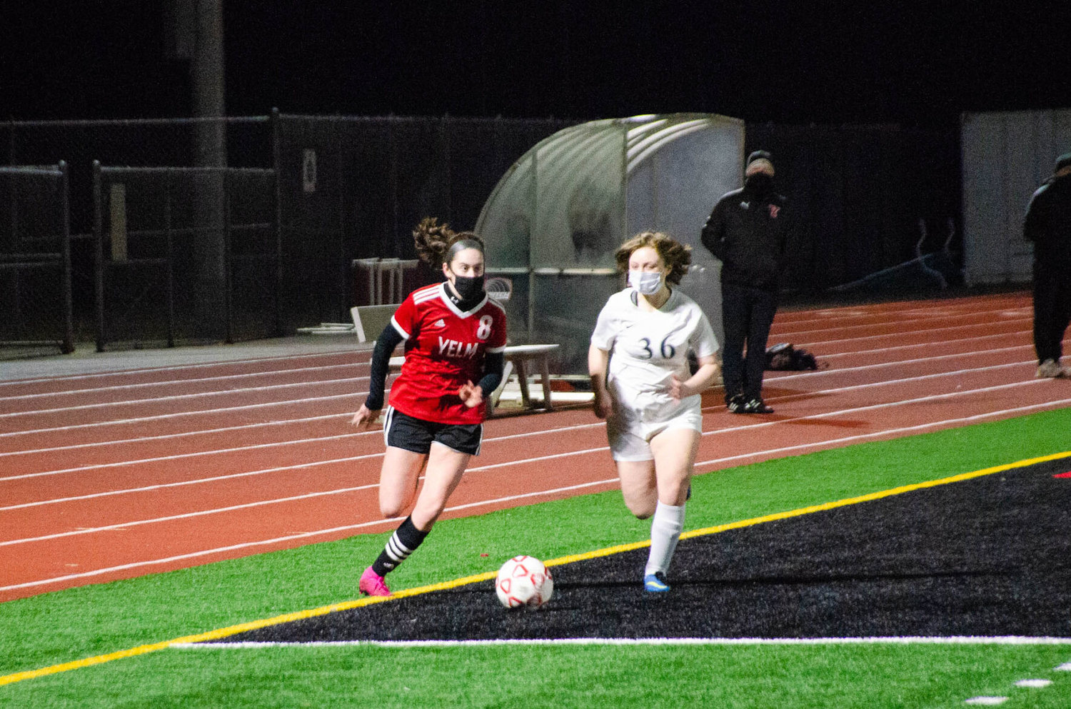 Junior defender Gabbi Becraft runs the ball up the line Tuesday at home against the River Ridge Hawks. 
