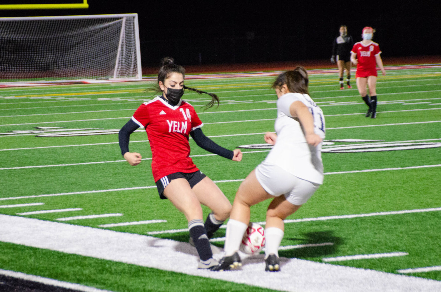 Junior fullback Socorro Scotto-Rodriguez, of Yelm, approaches River Ridge midfielder Meghan Kneable on the attack during a Tuesday night matchup. 