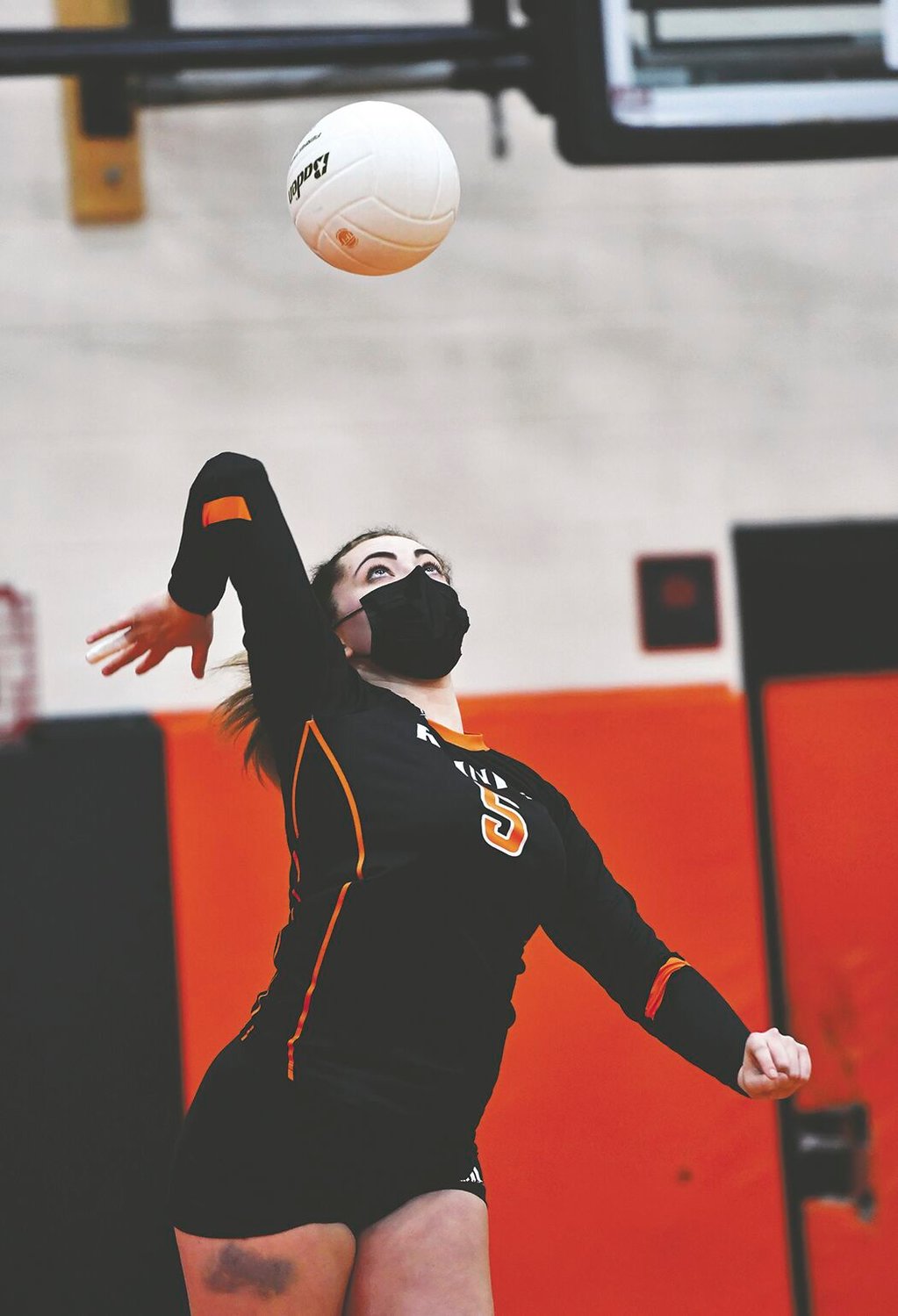 Rainier High School's Victoria Wadsworth serves to Onalaska High School during a Thursday night, March 4, volleyball match between the two schools.