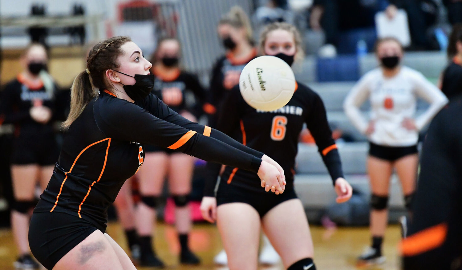 Rainier High School's Victoria Wadsworth bumps the ball to Onalaska High School during a Thursday night, March 4, volleyball match between the two schools.