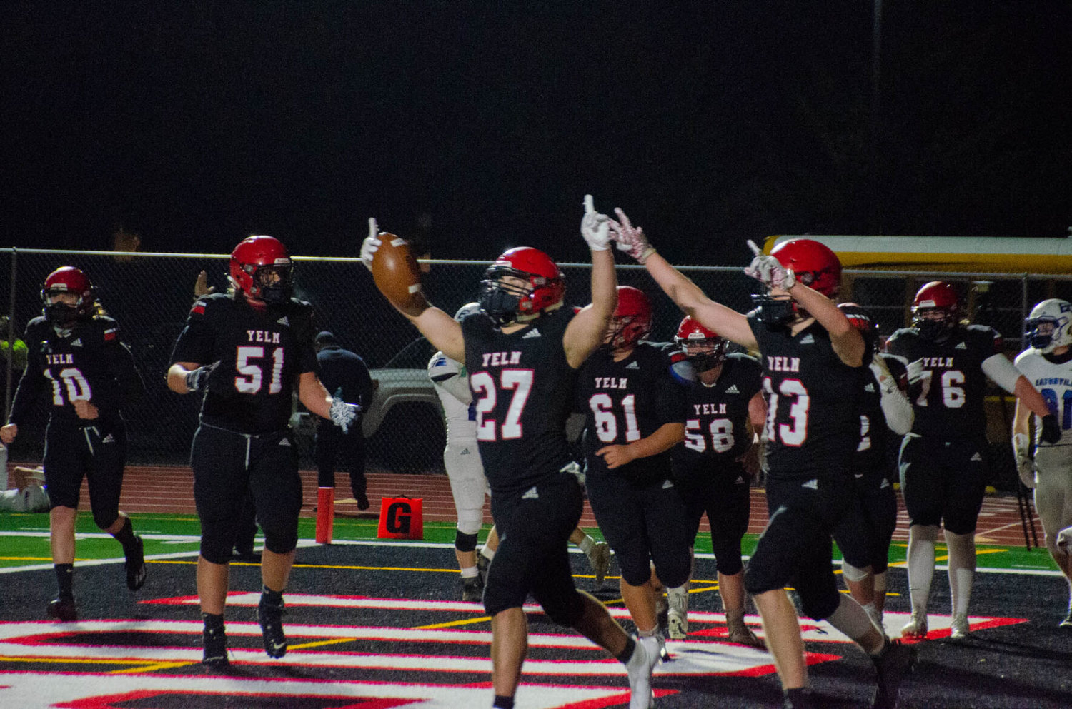 Senior running back Sean Rohwedder celebrates after making a fourth-quarter, 10-yard rush to bring Yelm the lead Wednesday night against Eatonville. Yelm extended its undefeated streak with a 29-19 win over the 1A team from across the river. 