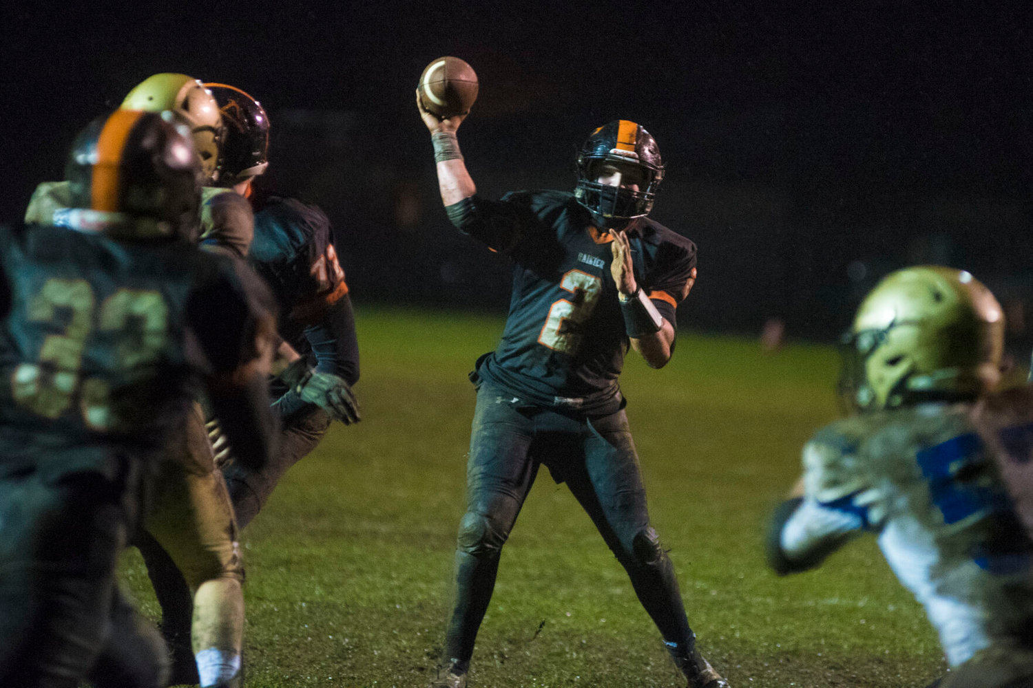 Rainier quarterback Mike Green winds up for a pass in the redzone against Adna Friday.