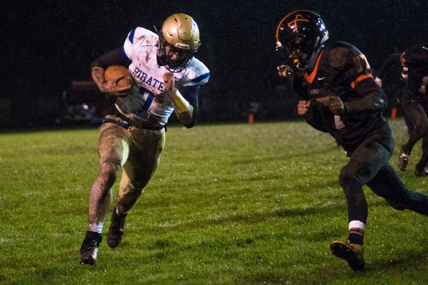 Adna running back Zach Berg braces for a collision with a Rainier defender Friday.