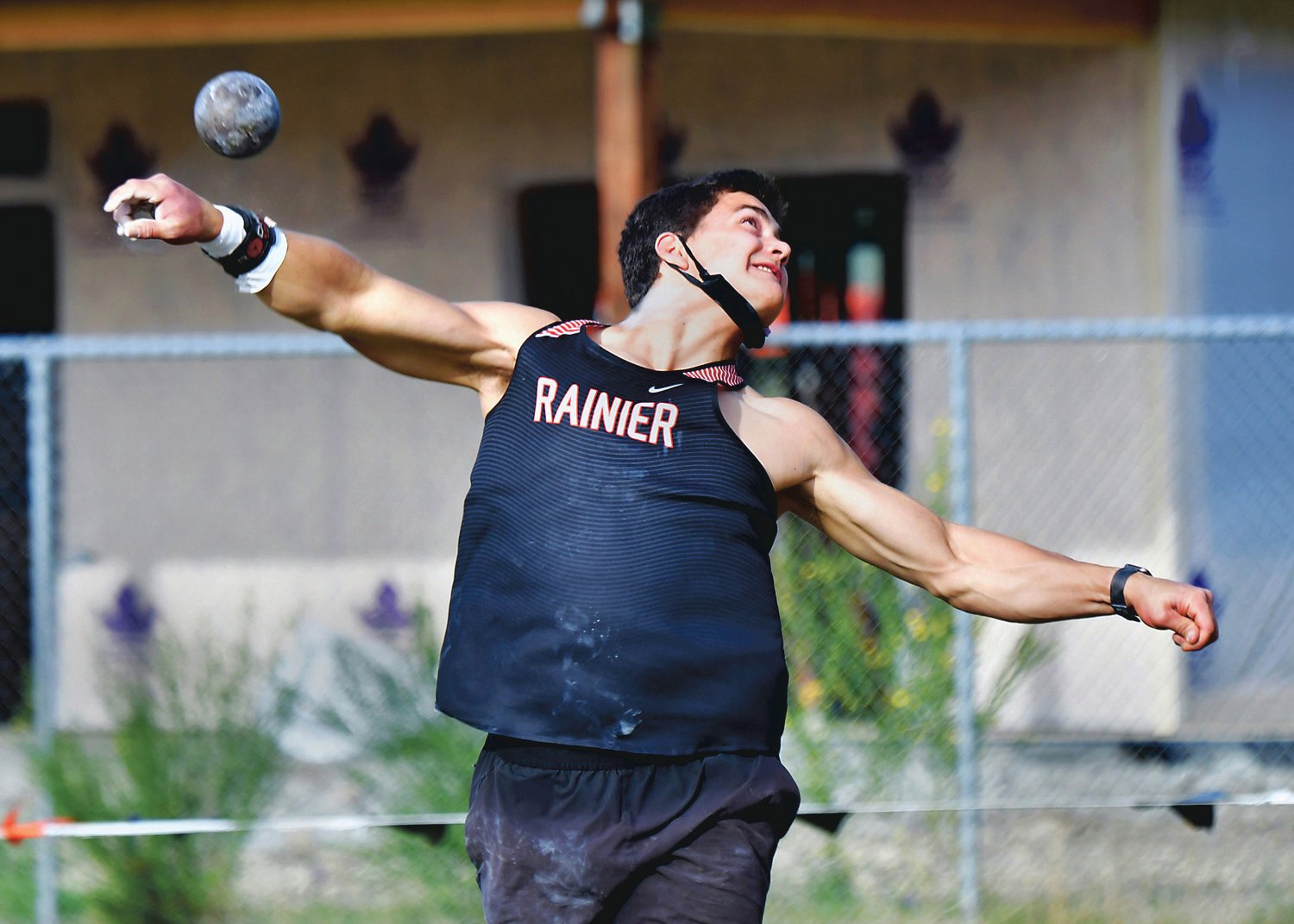 Rainier High School’s Jeremiah Nubbe unleashes a shot put on Thursday, April 29, during the WIAA 2B District 4 Track and Field Championships at Rainier High School.