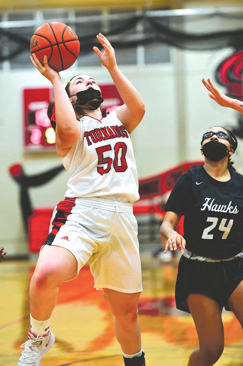 Samantha Rohwedder, Yelm High School varsity girls basketball wing, left, drives for a shot in the Tornados’ game Thursday, May 27, against River Ridge High School.