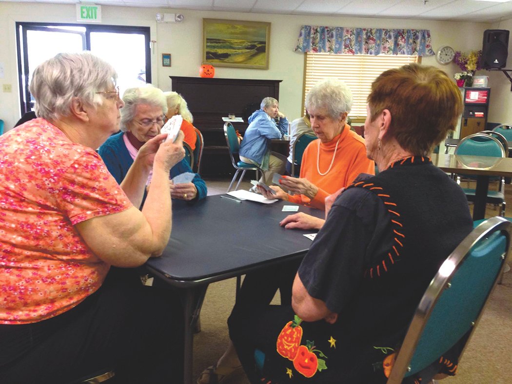 Seniors play a game at the Yelm Adult Community Center. Without bus drivers, some seniors are left homebound.