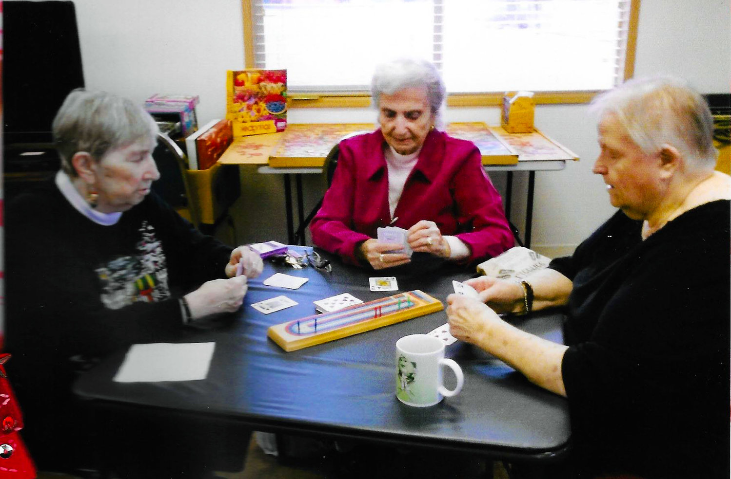 Seniors play a game at the Yelm Adult Community Center. Without bus drivers, some seniors are left homebound.