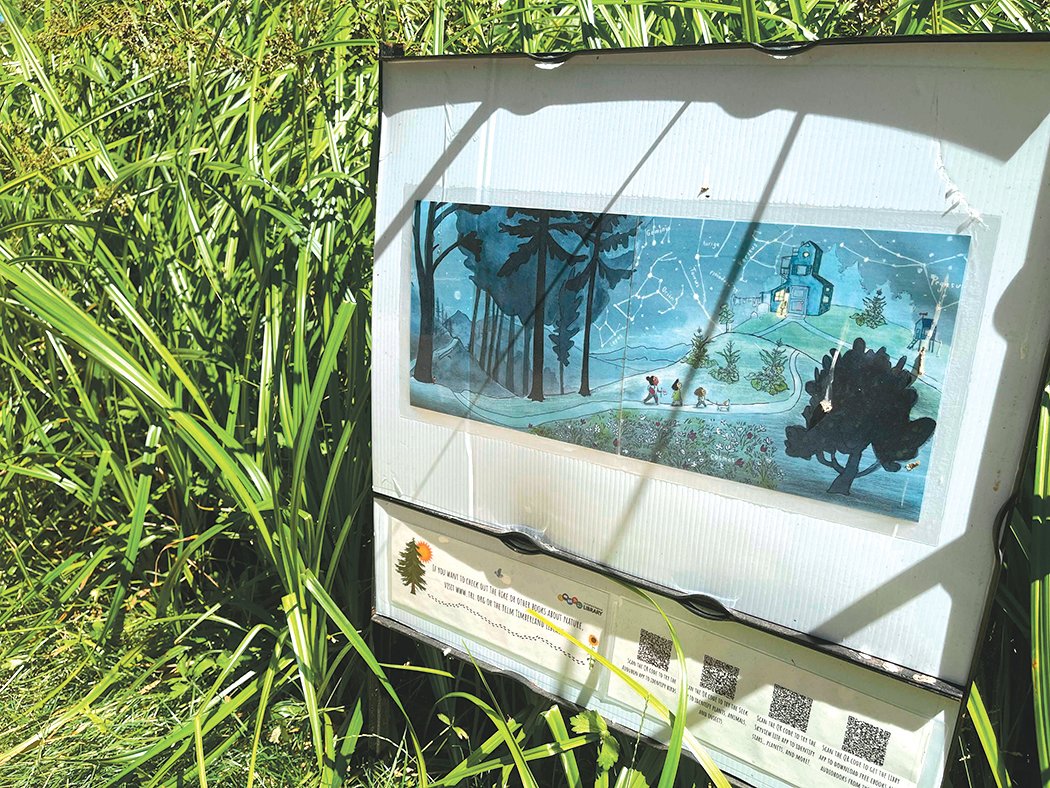 A page of a story trail focused on the book “The Hike” is pictured at Cochrane Memorial Park in Yelm.