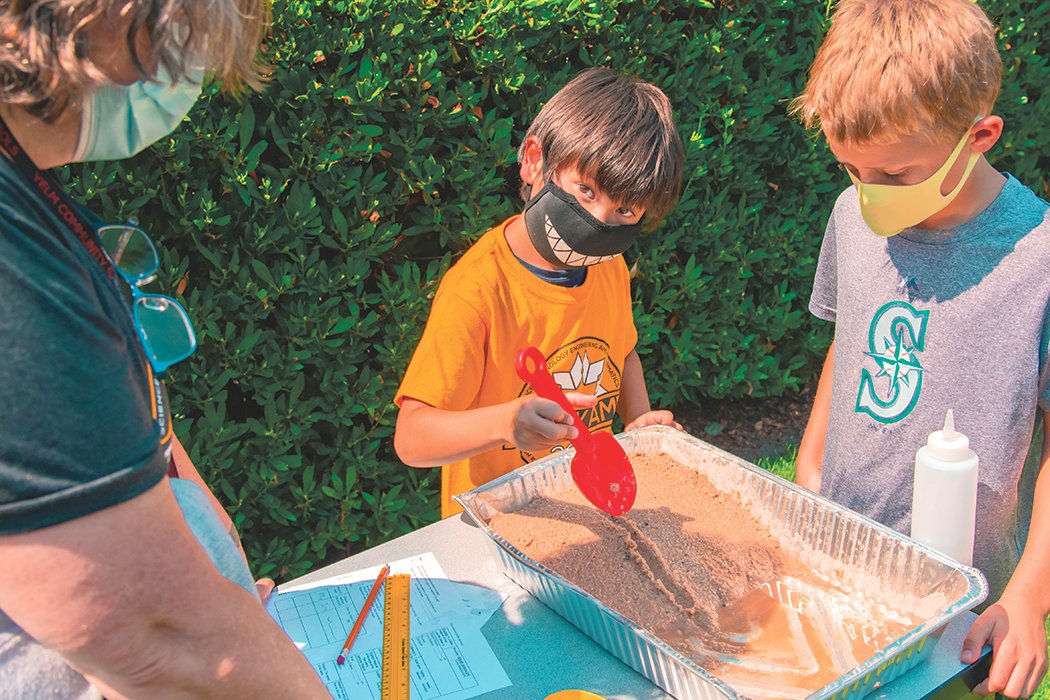 Students sport masks as they work outside and learn about erosion at Ridgeline Middle School during STEMKAMP on Thursday, Aug. 12 in Yelm.