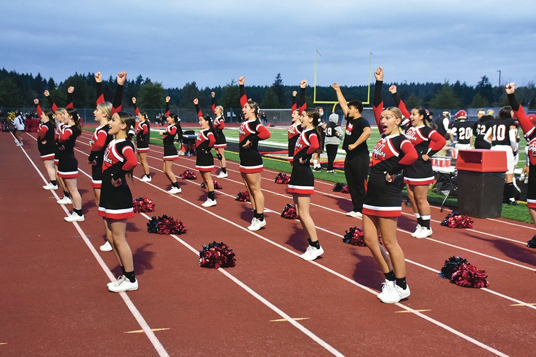 Yelm cheerleaders lead the stands in chants at a Sept. 17 Yelm High School football victory over Timberline.