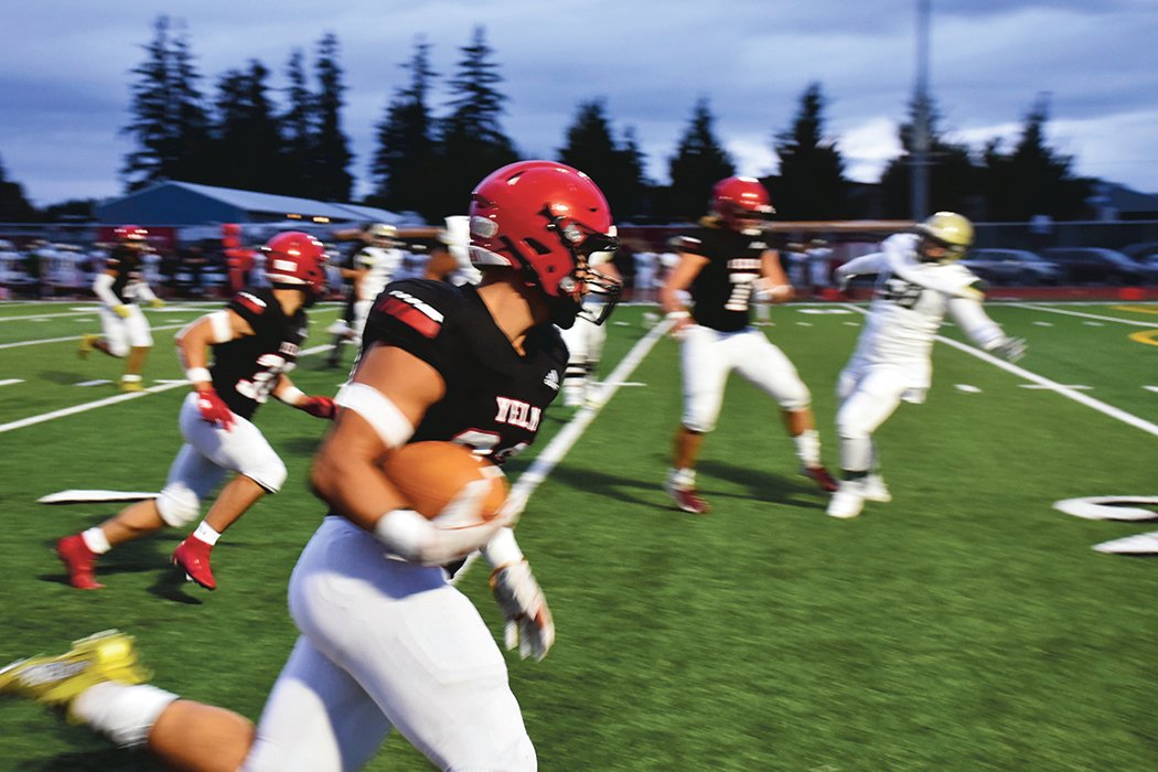 Sophomore Brayden Platt runs an interception to the endzone for a pick-6 during the first quarter in the Yelm victory again Timberline High School on Friday, Sept. 17.