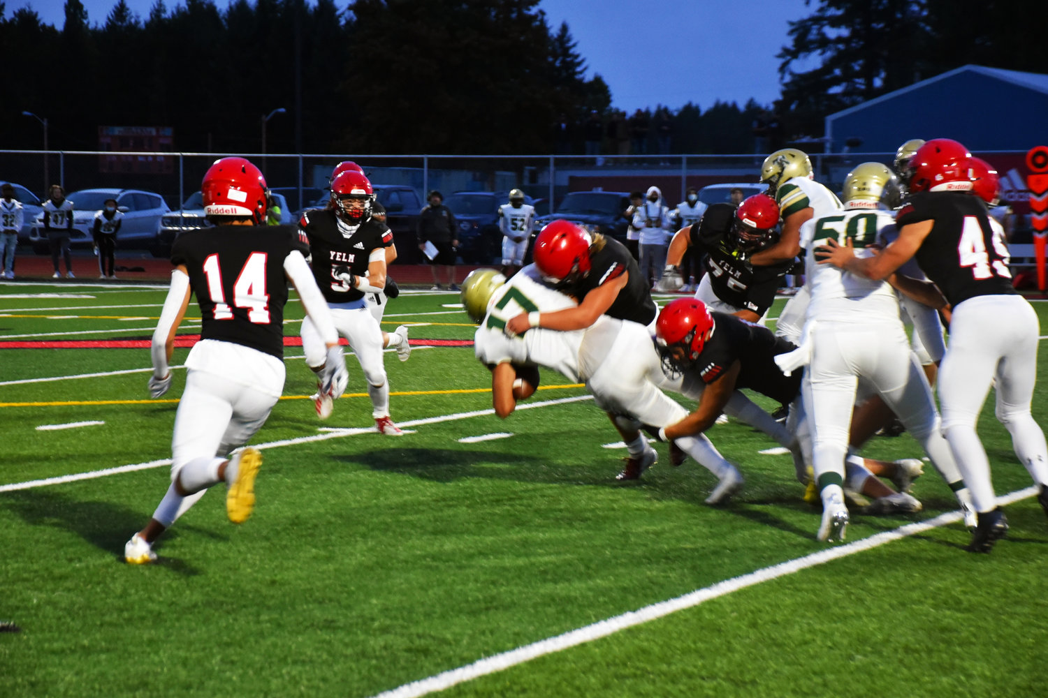 Yelm players take down a Timberline player on Friday, Sept. 17 at home.