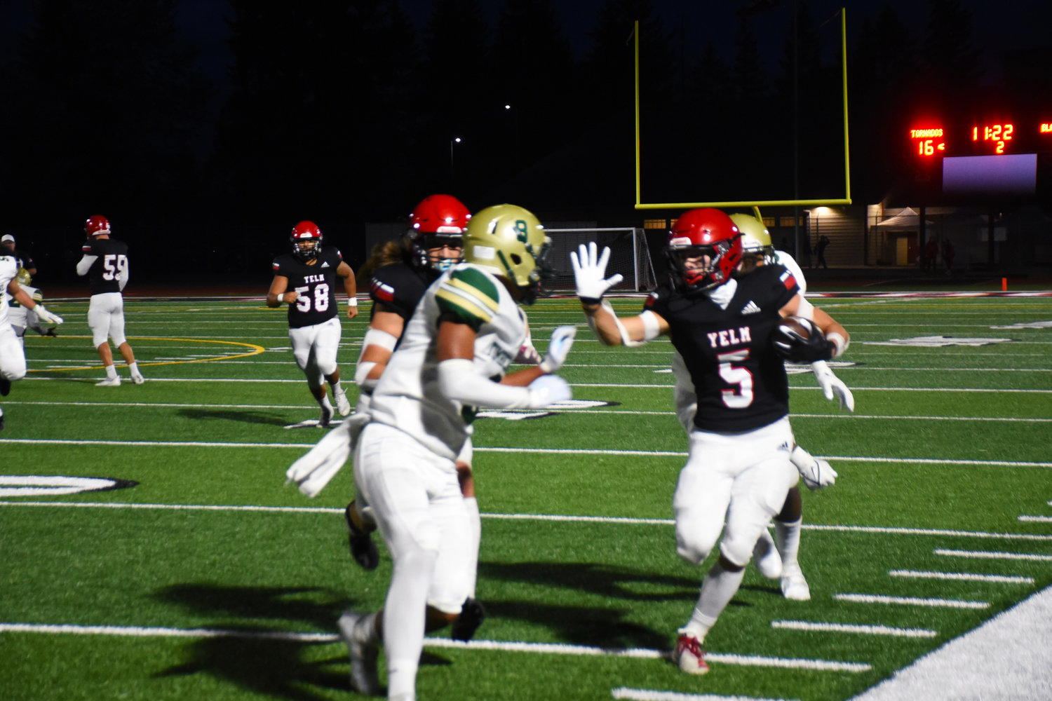 Kyler Ronquillo runs the ball at a game against Timberline High School on Friday, Sept. 17.
