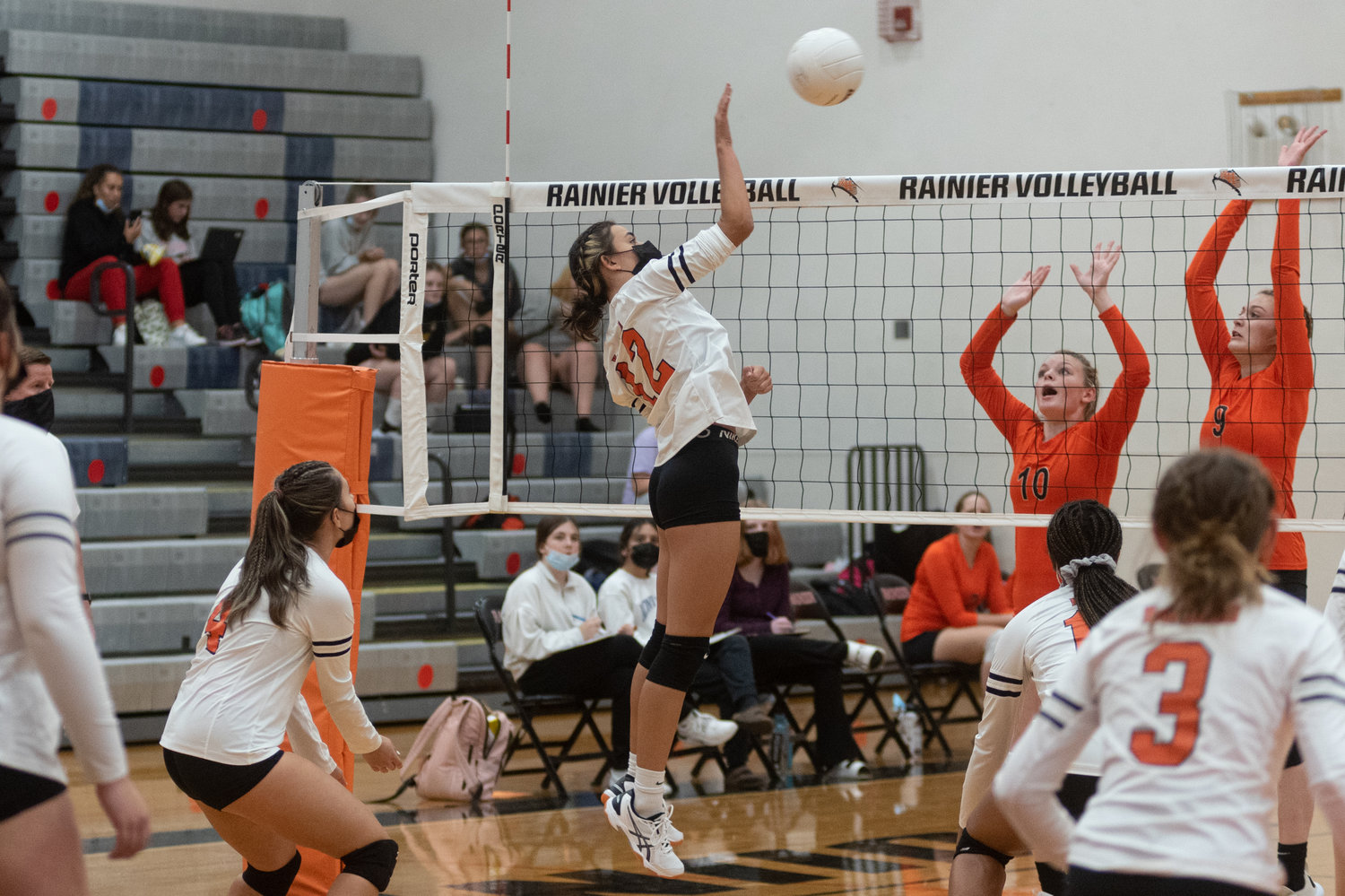 Rainier freshman outside hitter Acacia Murphy spikes the ball in the Mountaineers match against Napavine Monday night.