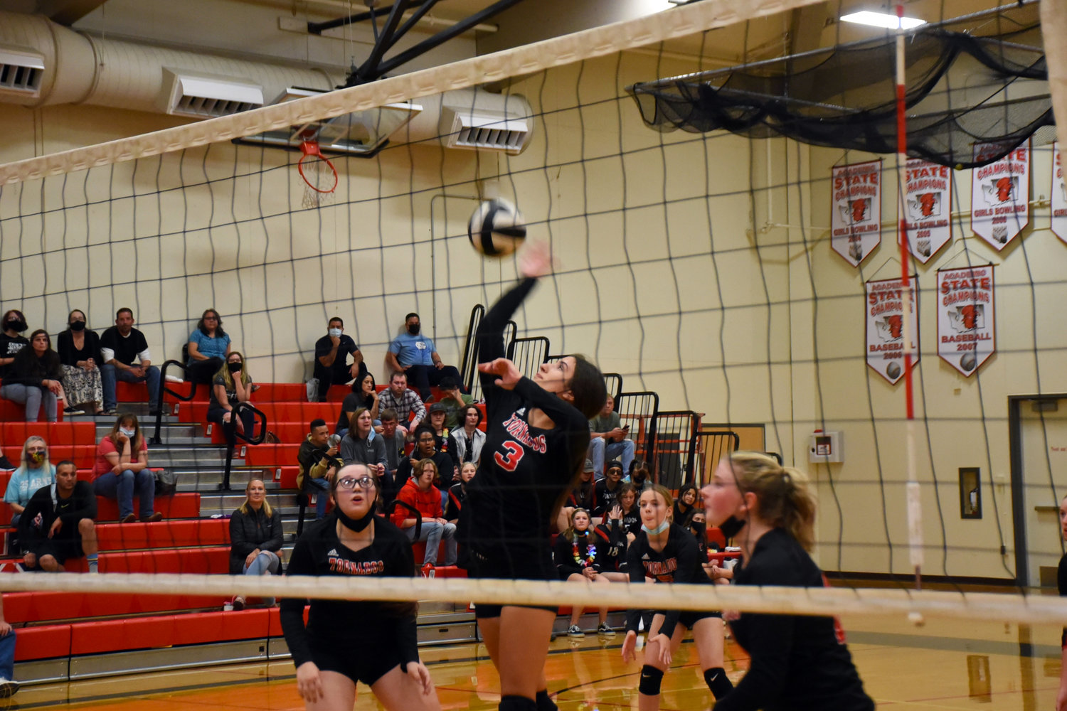 Selina Perez (#3) hits the ball over the net in a volleyball match against Peninsula High School on Thursday, Sept. 23 at Yelm High School.