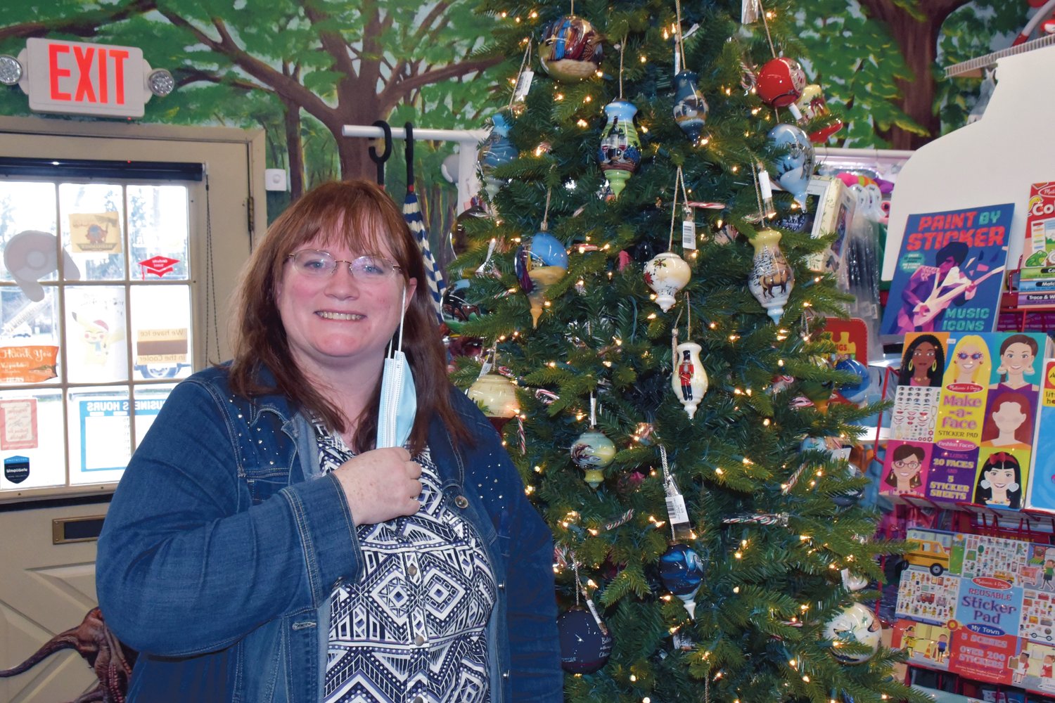 Heather Ekland, the owner of Funtime Toys and Gifts in Yelm, works the Christmas rush this holiday season.