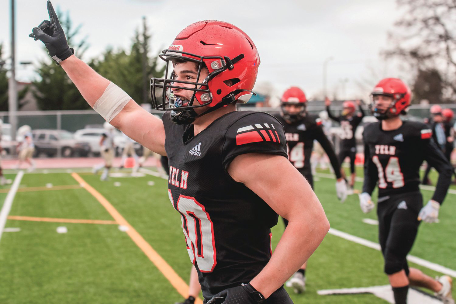 Yelm’s William Carreto (30) holds up a finger after making an interception during a playoff game against the Mead Panthers Nov. 6 at Yelm High School.