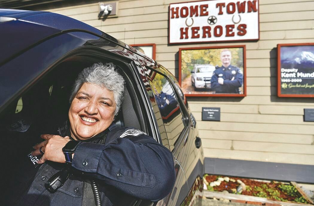 New Roy Police Chief Sonia Gomez-Armitage smiles from her vehicle in the winter of 2021.