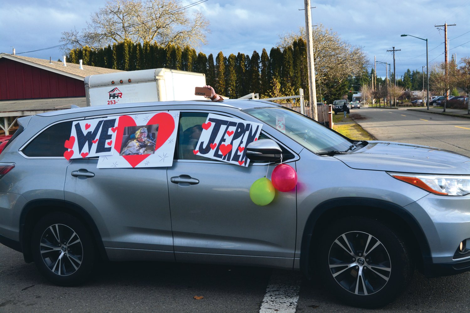 A Yelm resident displays their love for Jeren Pollock through signs and other decorations during a car parade on Jan. 8.