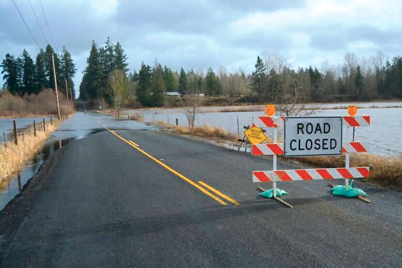 The road near the intersection of 336th Street and 16th Avenue in Roy was closed on Friday, Jan. 7 because of water of the roadway.