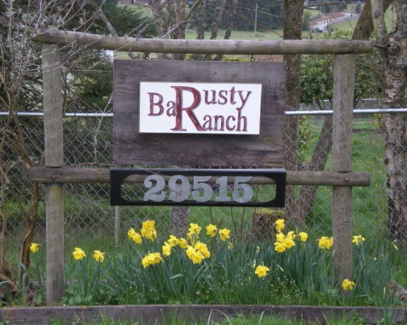 The sign for the Rusty Bar Ranch in Roy is pictured.