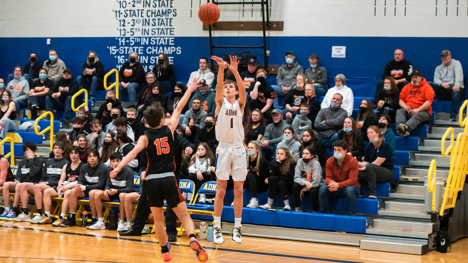 Adna’s Seth Meister (1) scores from behind the three-point line Friday night.