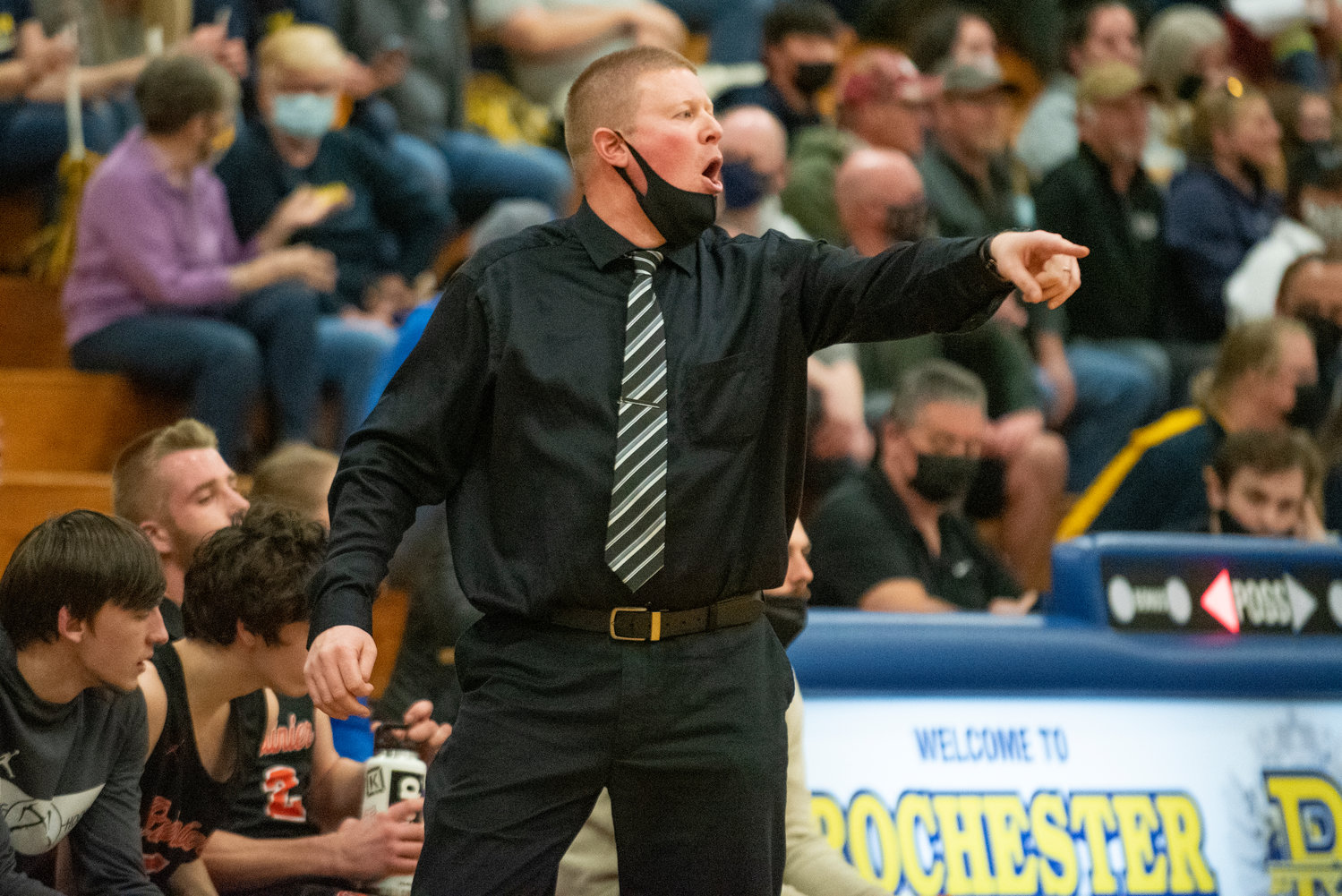 Rainier coach Ben Sheaffer calls out instructions to his team during a district playoff game against Ilwaco on Feb. 11.
