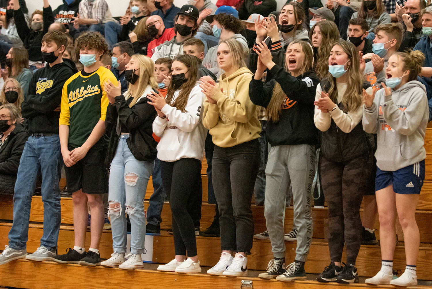 Rainier's student section cheers on the Mountaineers' boys team during a district playoff game against Ilwaco on Feb. 11.