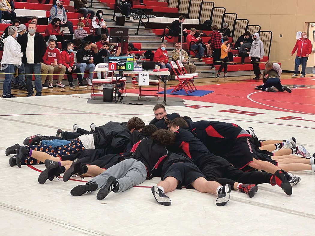 The Yelm boys wrestling team is pictured at the regional tournament before matches begin.