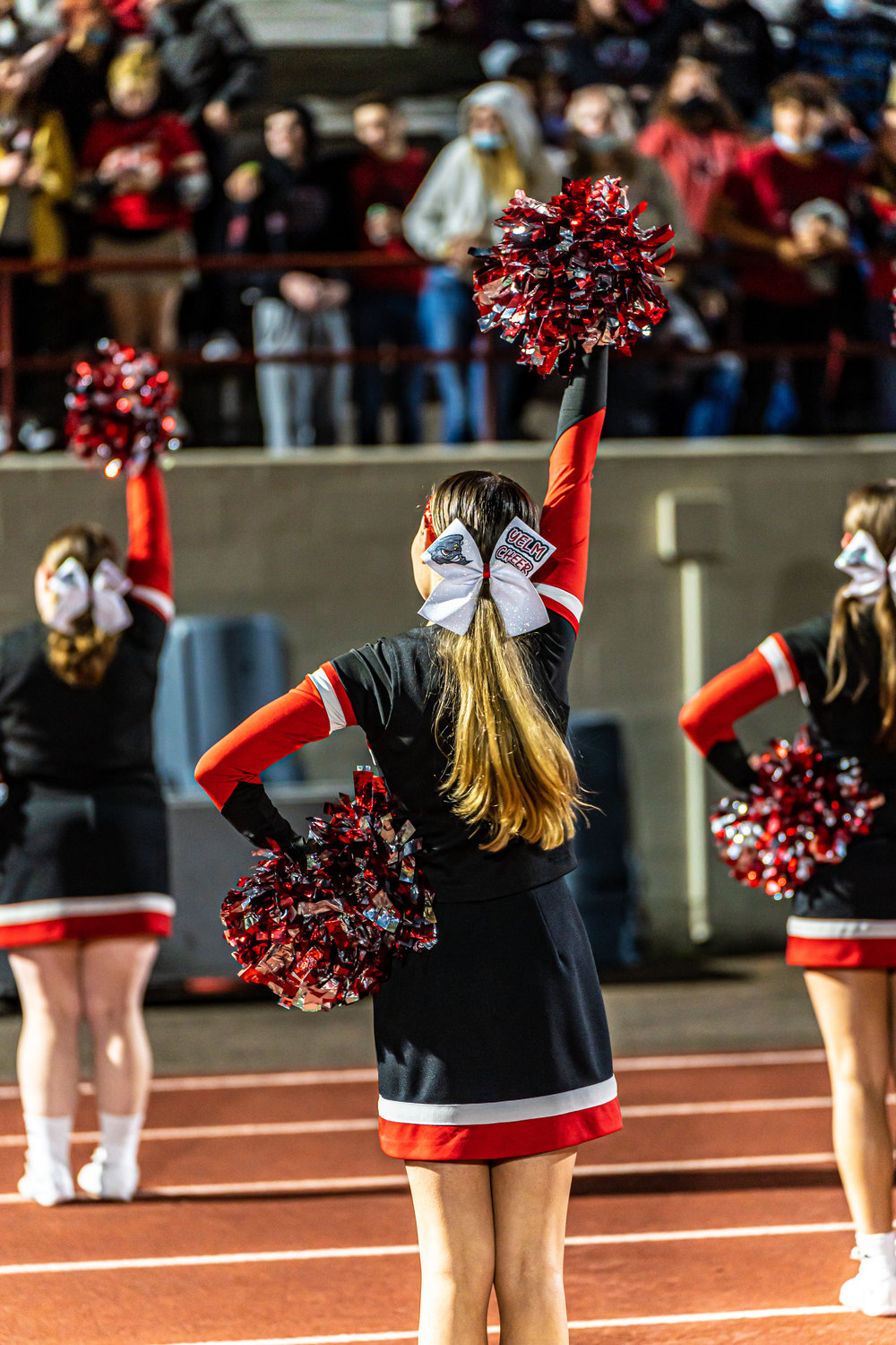 Cheerleaders from Yelm perform at a football game.