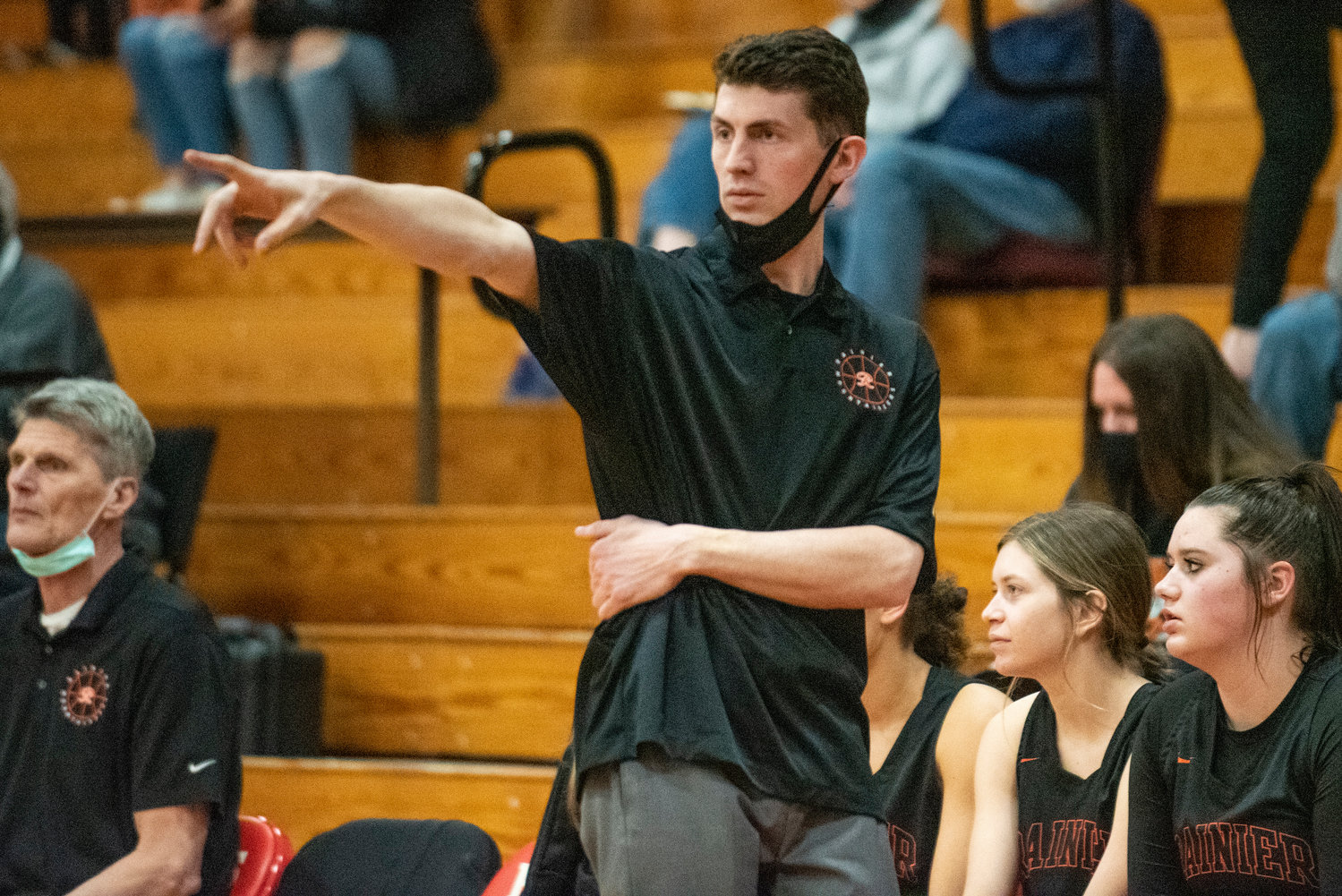 Rainier girls basketball coach Brandon Eygabroad calls out instructions to his team during a game against Forks on Feb. 15.