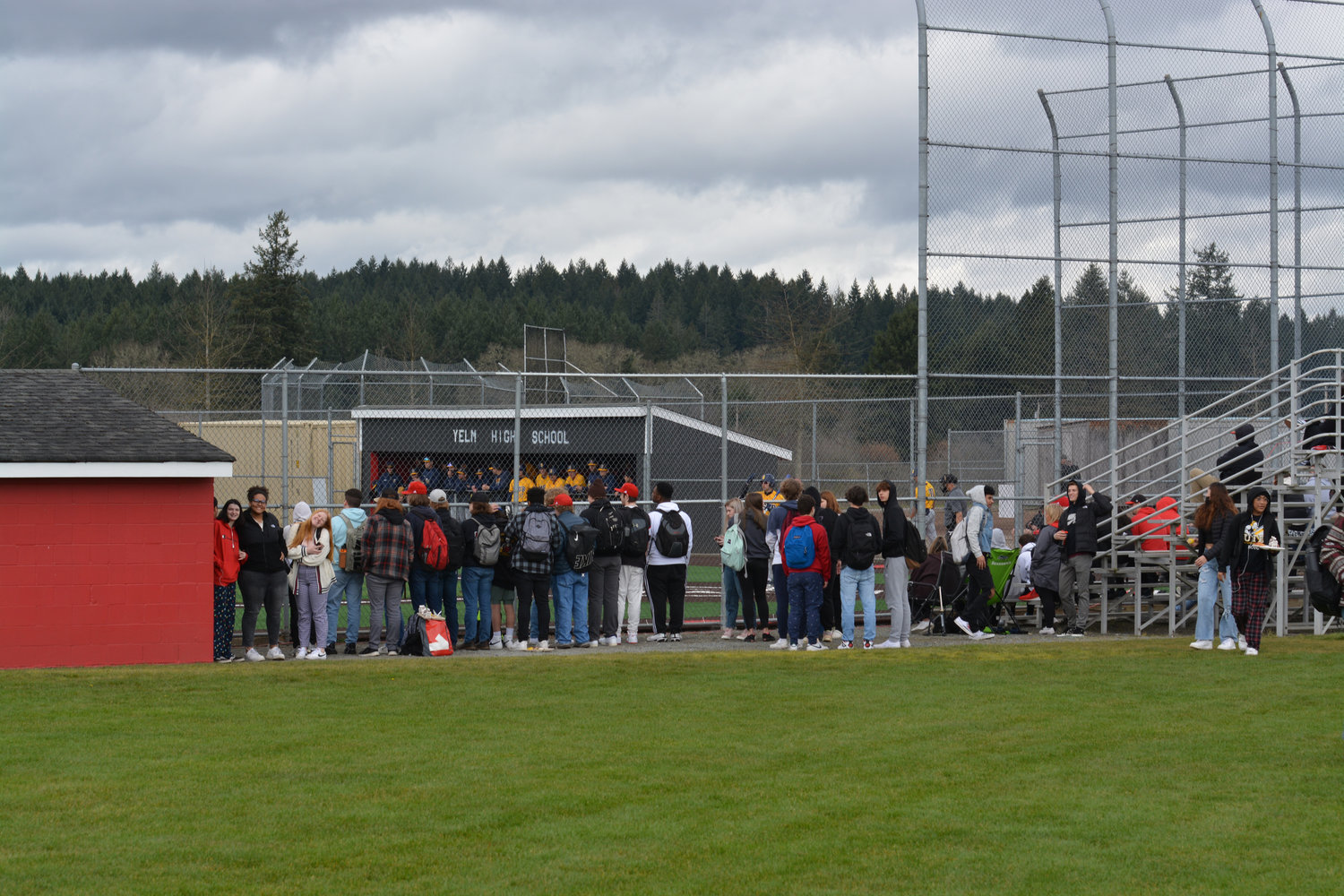 Yelm High School students look on as Saint Martin's University faces off against Montana State Billings on March 18 in Yelm.