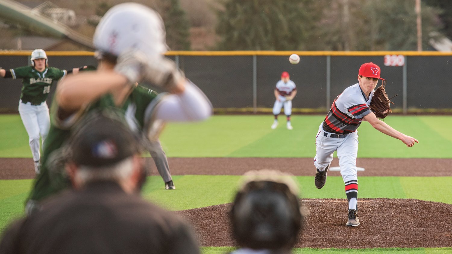 Yelm’s Austin Richardson (23) throws a pitch during a game against the Blazers on Tuesday, March 15.