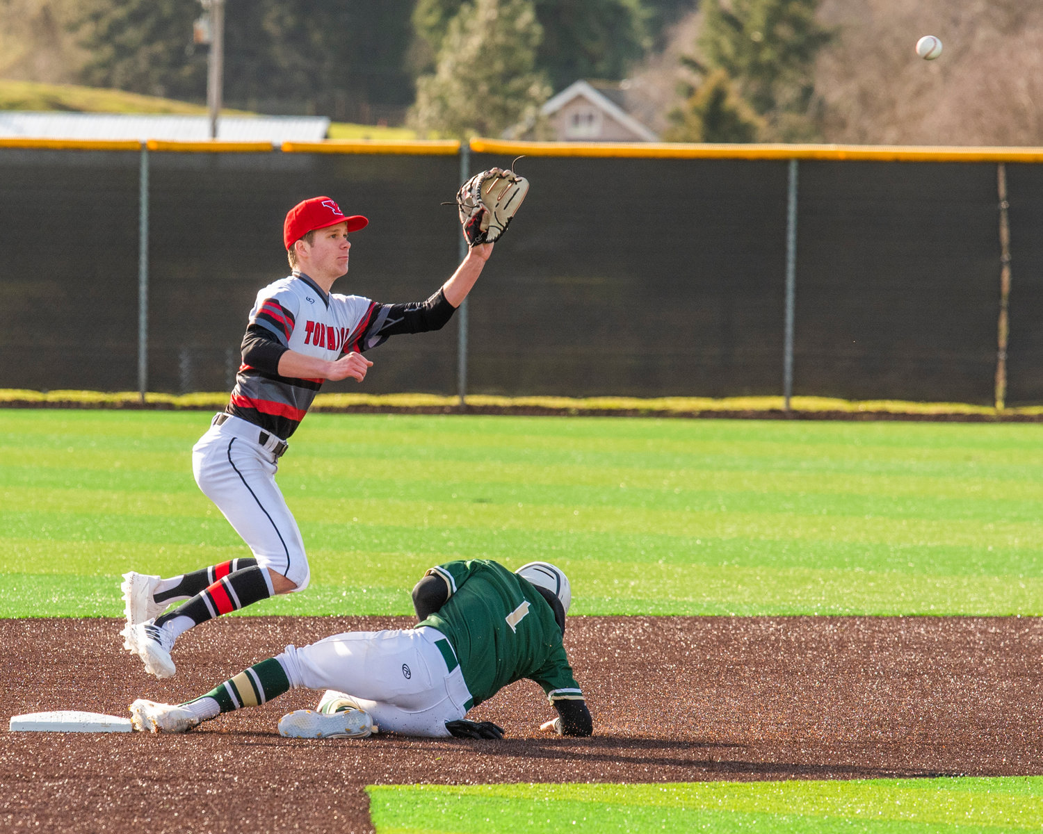 Yelm’s Dawson Schnetz (2) receives a throw down to second during a game on Tuesday, March 15.