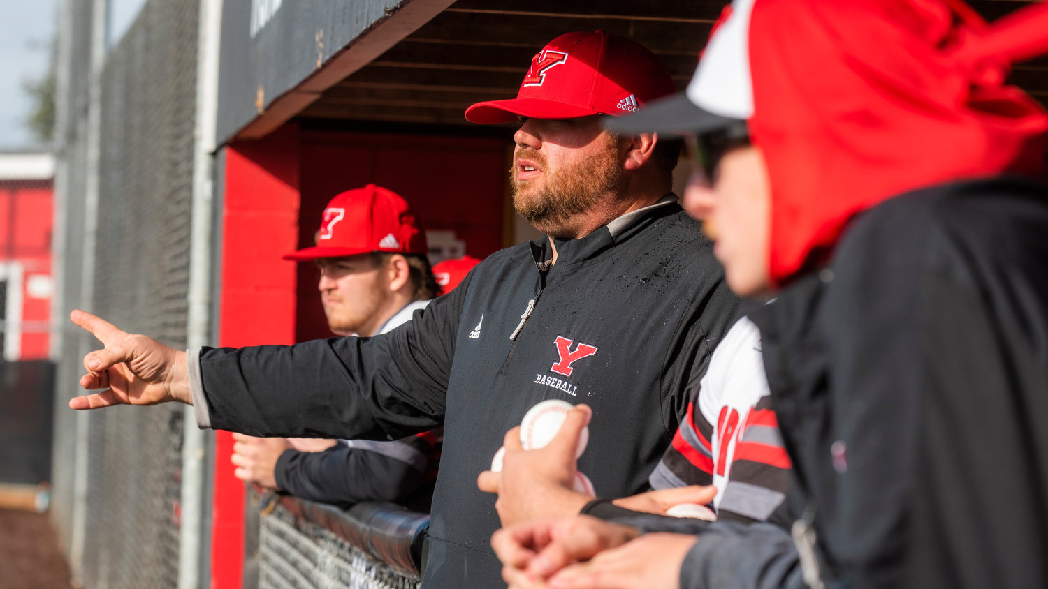 Tornado Baseball Coach Zach Miller signals to athletes during a game on Tuesday, March 15.