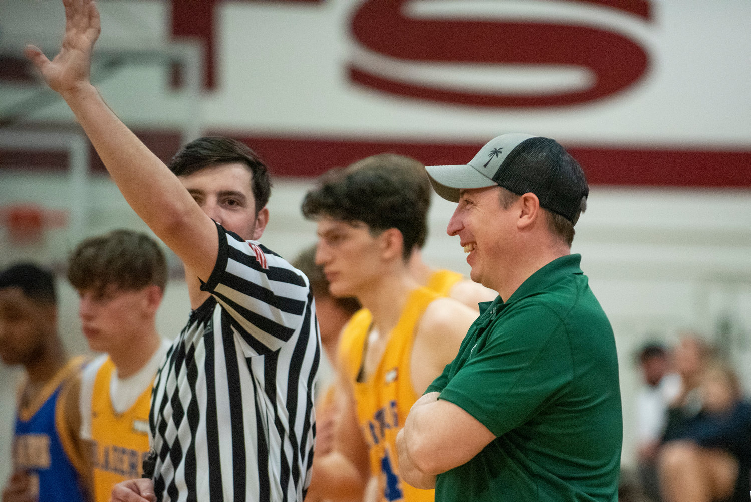 Morton-White Pass boys basketball coach Chad Cramer, right, talks with an official during the SWW Senior All-Star Game on March 26.