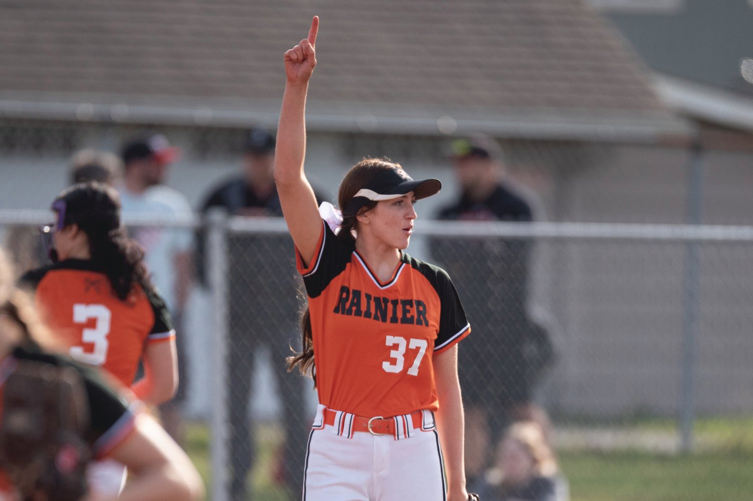 Rainier pitcher Bailey Elwell raises a finger after getting an out against Tenino March 24.