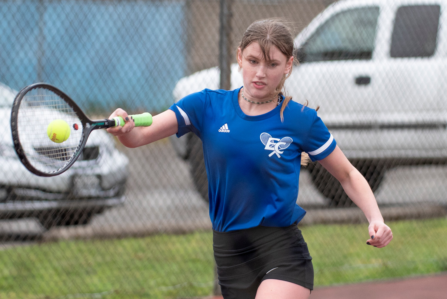 Eatonville's No. 1 singles player returns a hit from Tenino's Megan Letts during a game in Tenino on March 29.