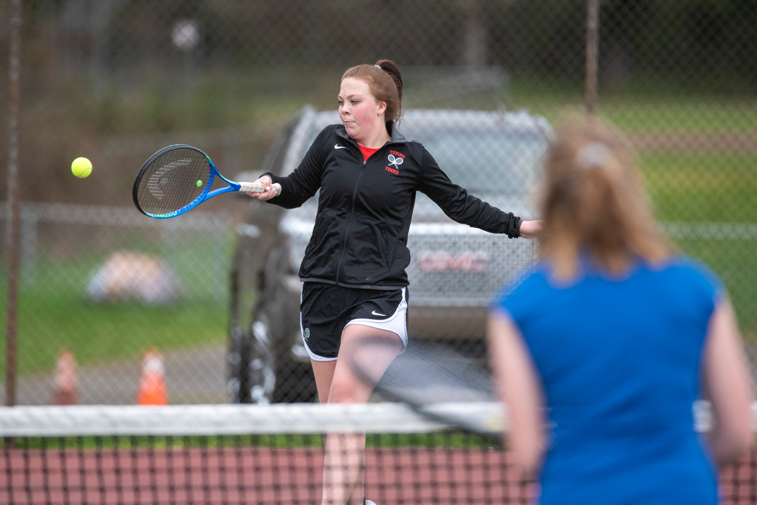 Tenino's Destiny Sampley returns a hit from an Eatonville player in the No. 1 doubles match at home on March 29.