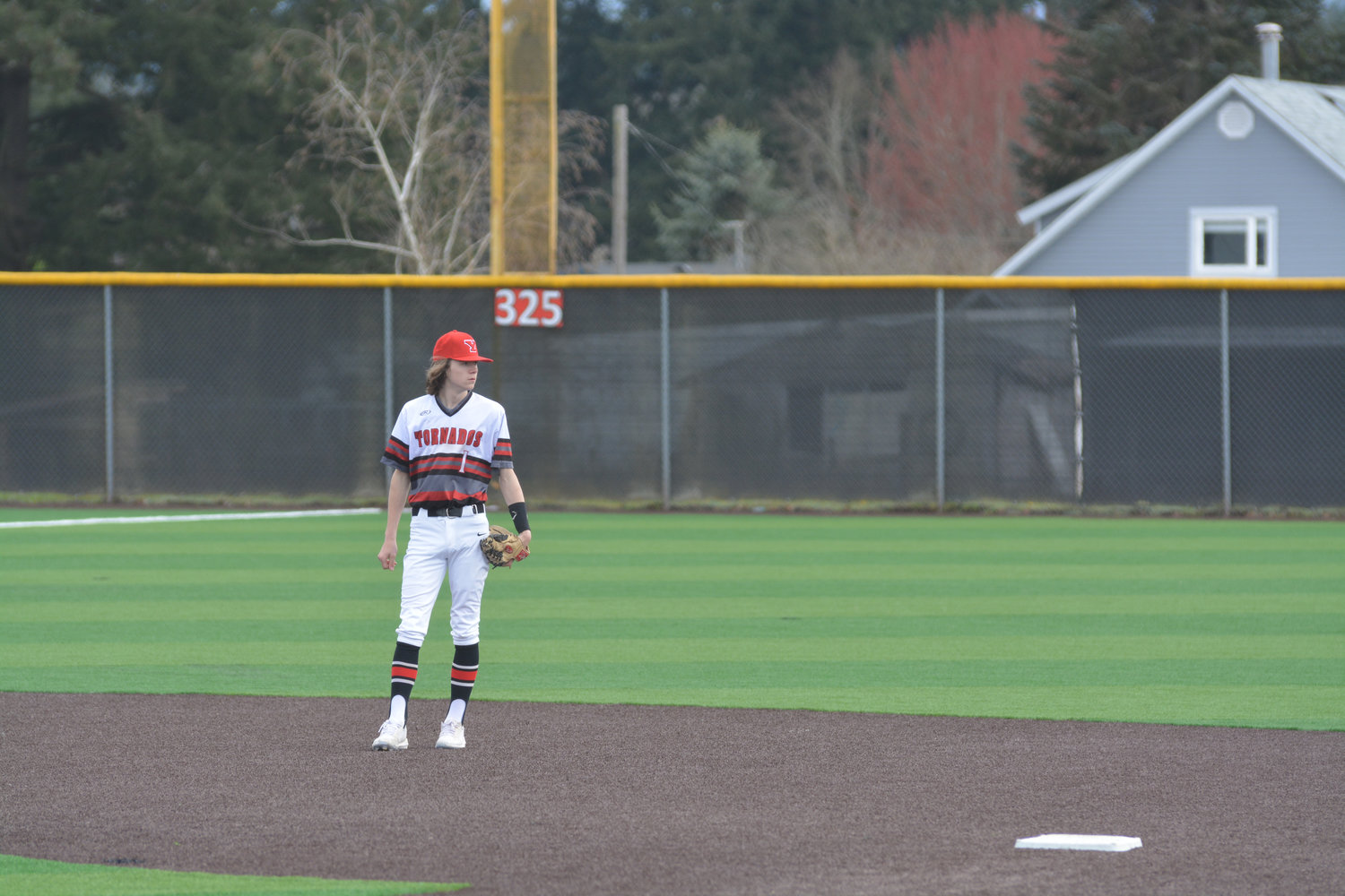 Senior infielder Kyle Olmstead communicates with the second baseman in between pitches on Friday, April 1 during a game against Steilacoom High School.
