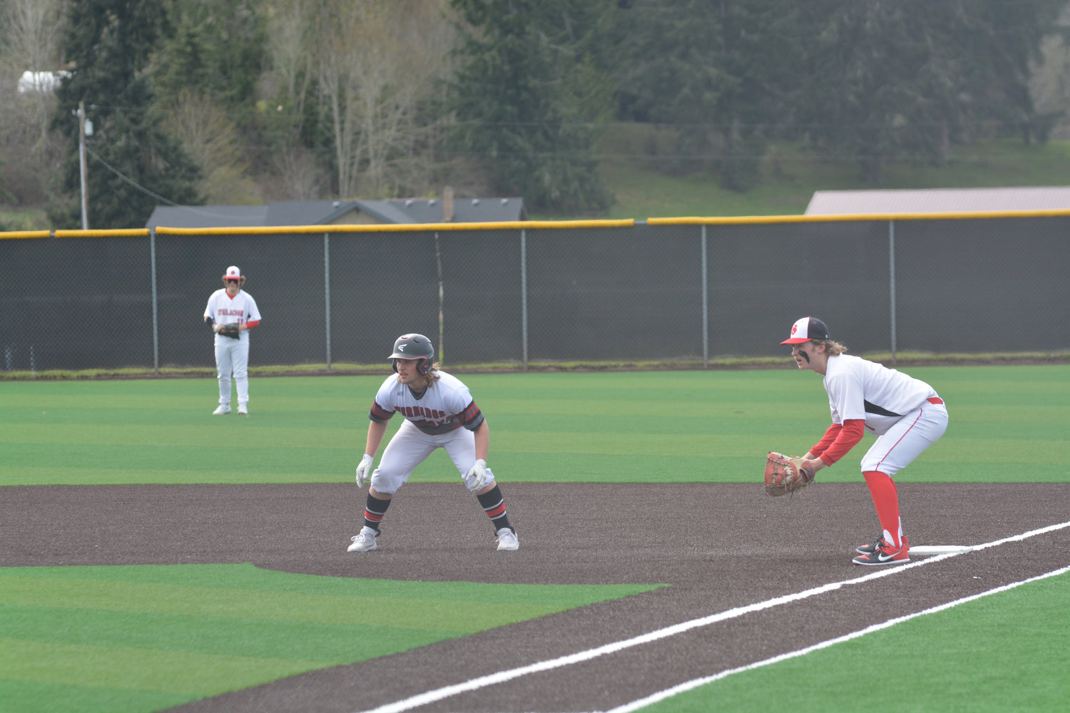Senior first baseman Jeremy Reimers takes a lead after a base hit on April 1 in a game against Steilacoom.
