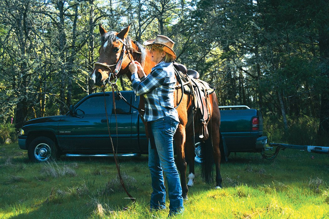 Nita Allen prepares her Morgan quarterhorse Cyrus for the trail on April 24.