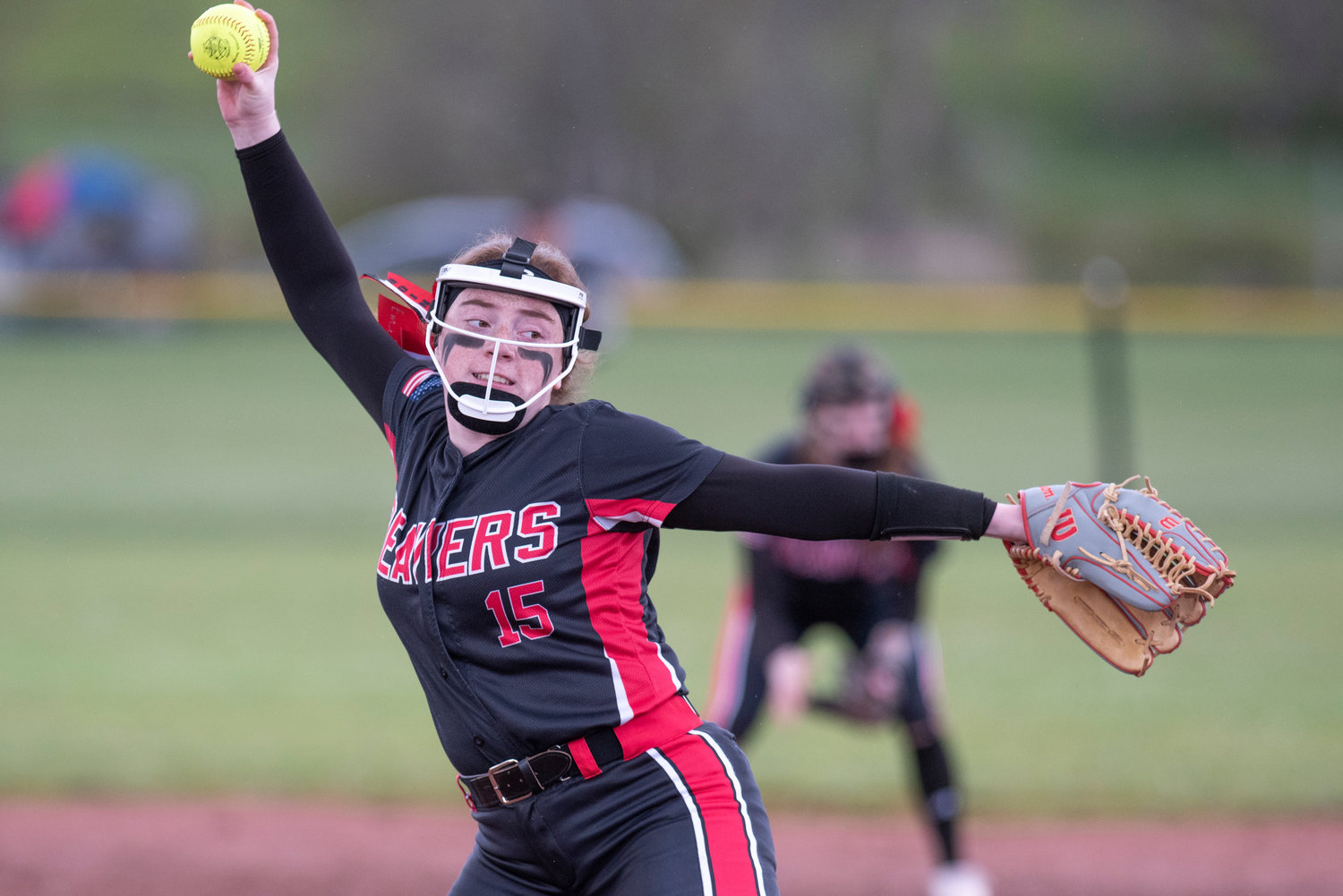 Tenino pitcher Emily Baxter winds up to deliver a pitch to an Elma batter during a league home game on April 26.