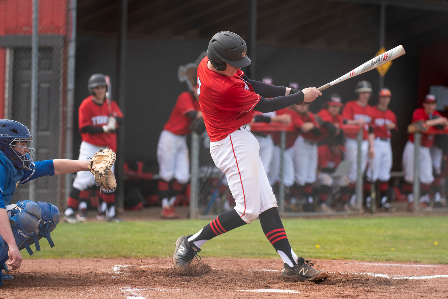 Tenino's Austin Gonia fouls an Elma pitch off during a home game on April 29.