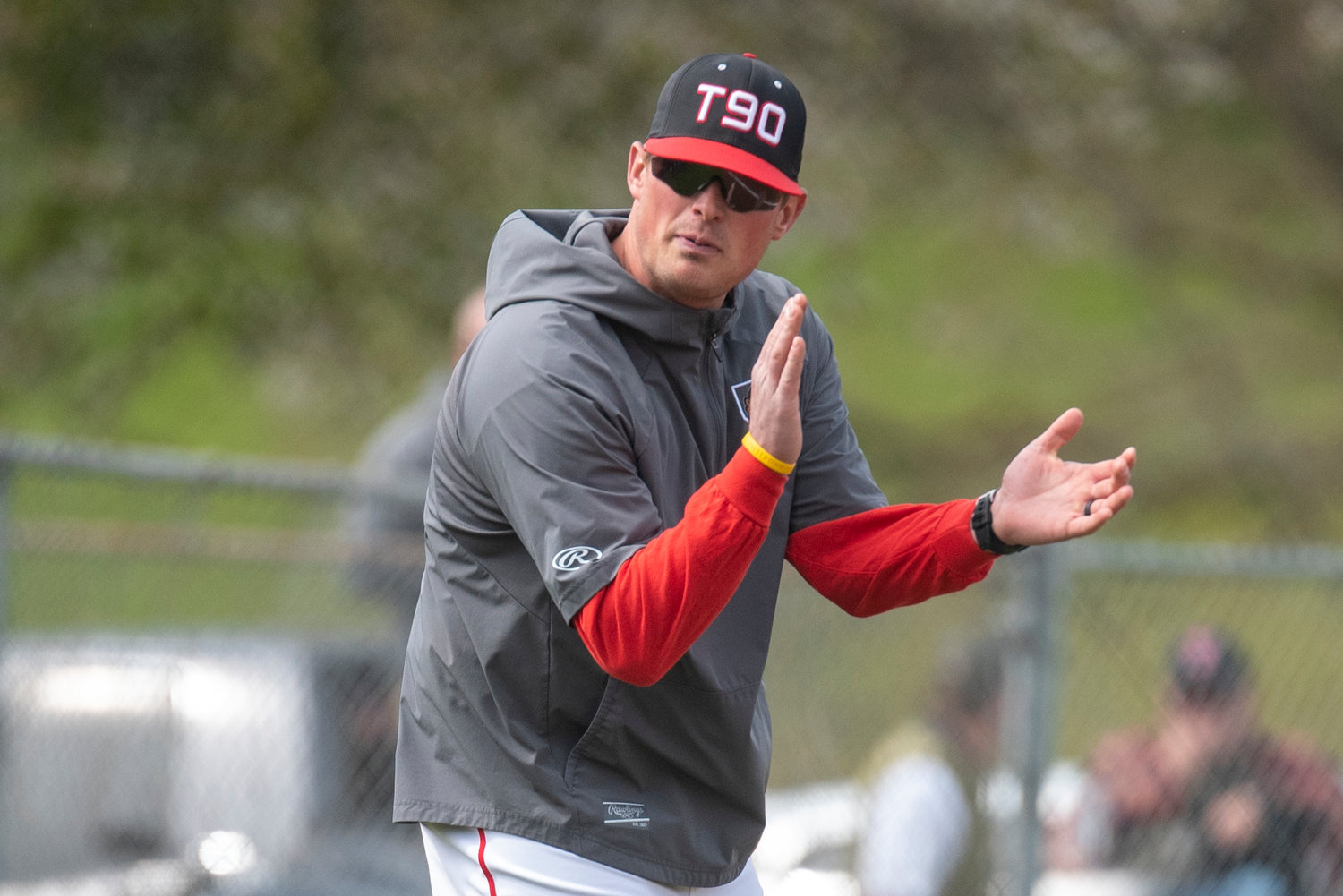 Tenino baseball coach Ryan Schlesser encourages a Beaver batter during a home game against Elma on April 29.