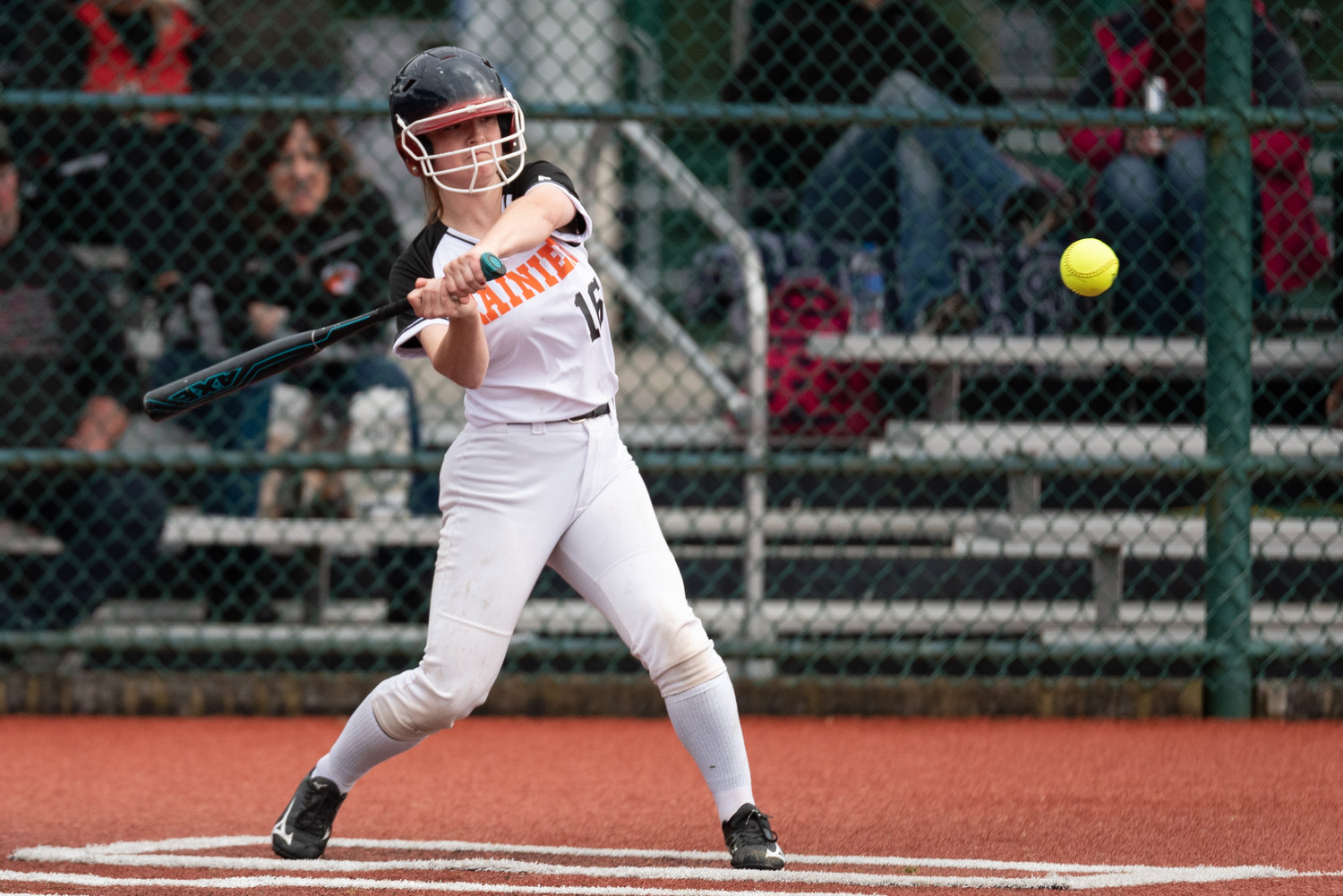 Rainier's Carolyn Ferguson swings at a pitch against Napavine at the Lacey Regional Athletic Complex May 6.